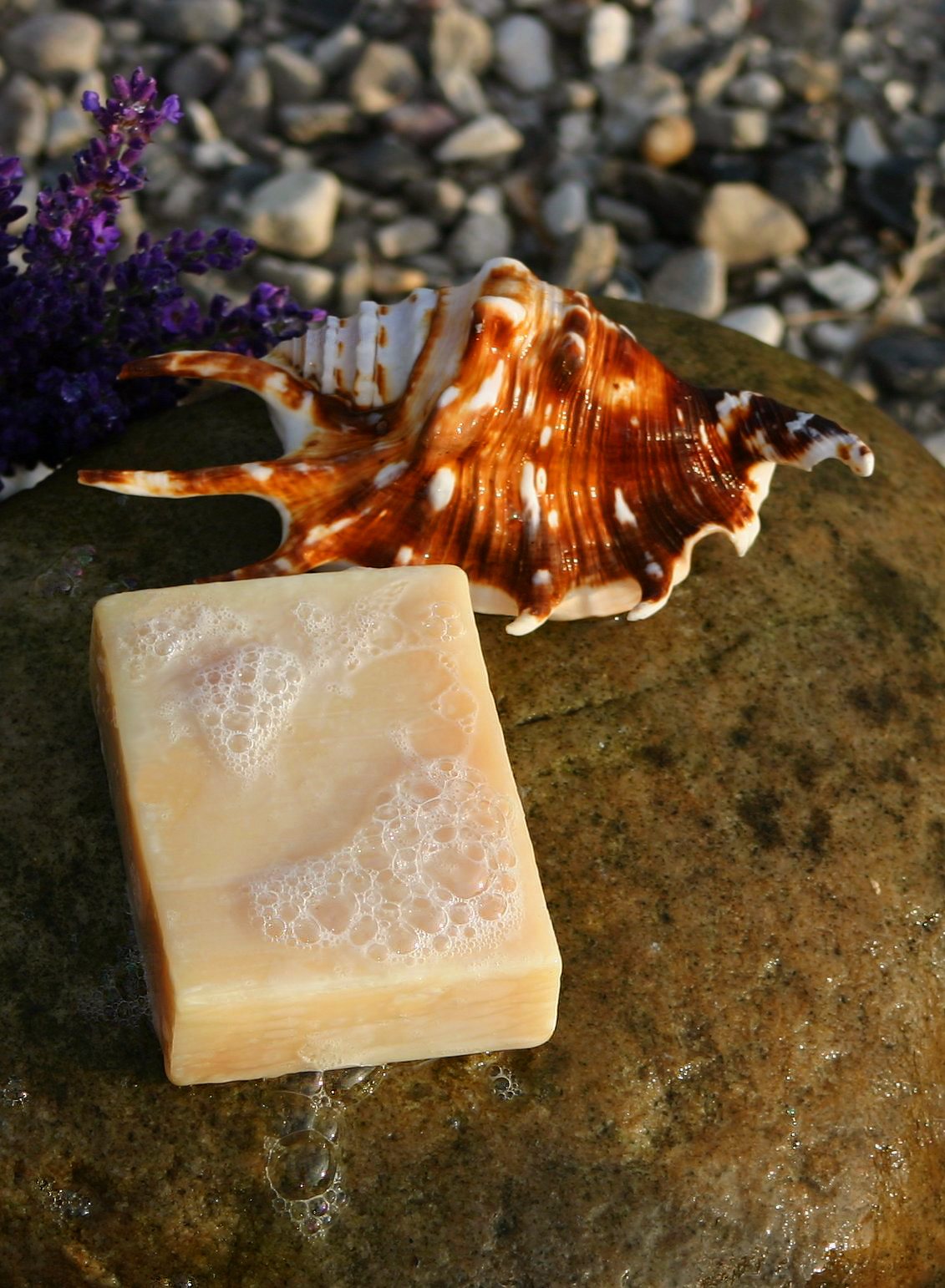 A bar of handmade soap covered in lather